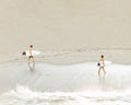 Surfers Walking Oh The Beach